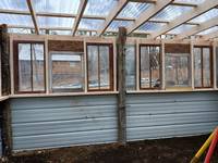 Here you can see the recycled windows that were custom framed in. This gave the greenhouse so much character.