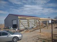 Progress, posts & rafters, pearling and headers installed. A great start to a large carport.