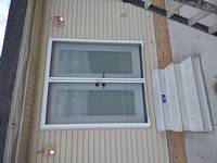 French doors with a roll up screen installed.
